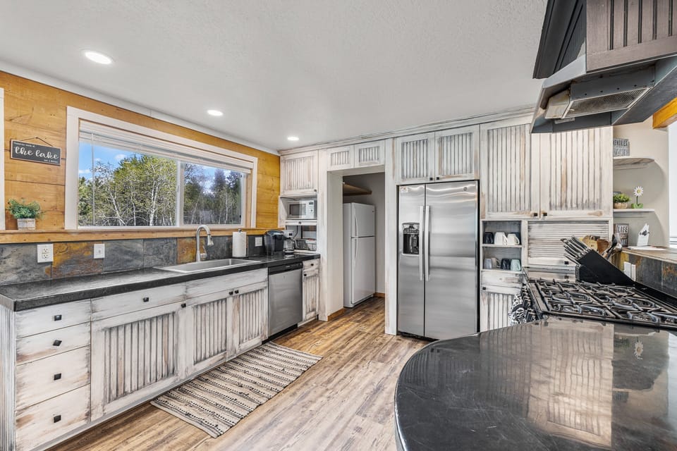 Kitchen on the main level with a large pantry