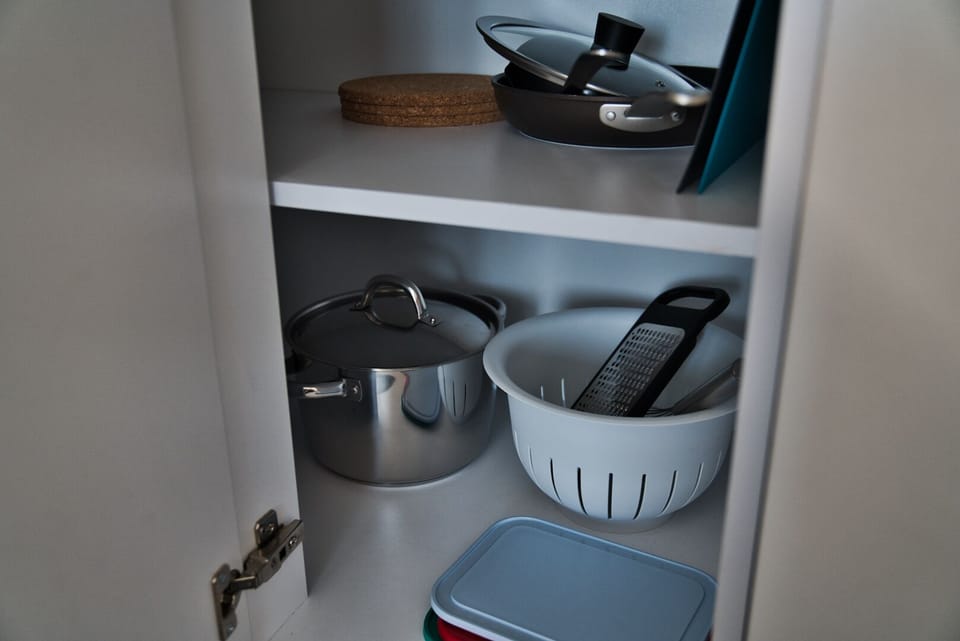 All the necessary kitchen appliances, a grater, cooking pot and others