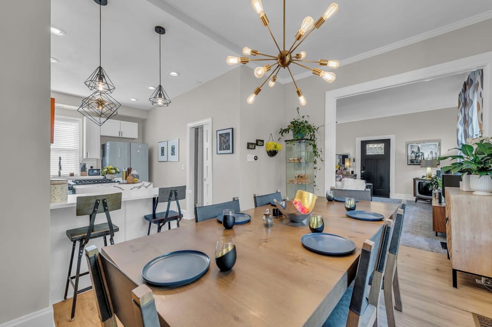 Modern dining space flows into sleek kitchen—perfect for entertaining