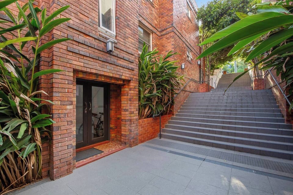 Access the apartment through a private entry tucked at the base of a leafy stairway, offering a peaceful sense of seclusion just moments from Coogee’s buzz.