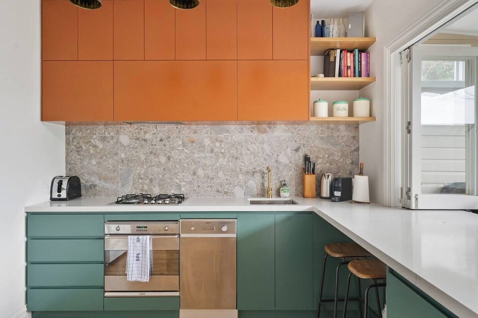Morning rituals are made better with a Nespresso machine, modern appliances, and a leafy outlook.