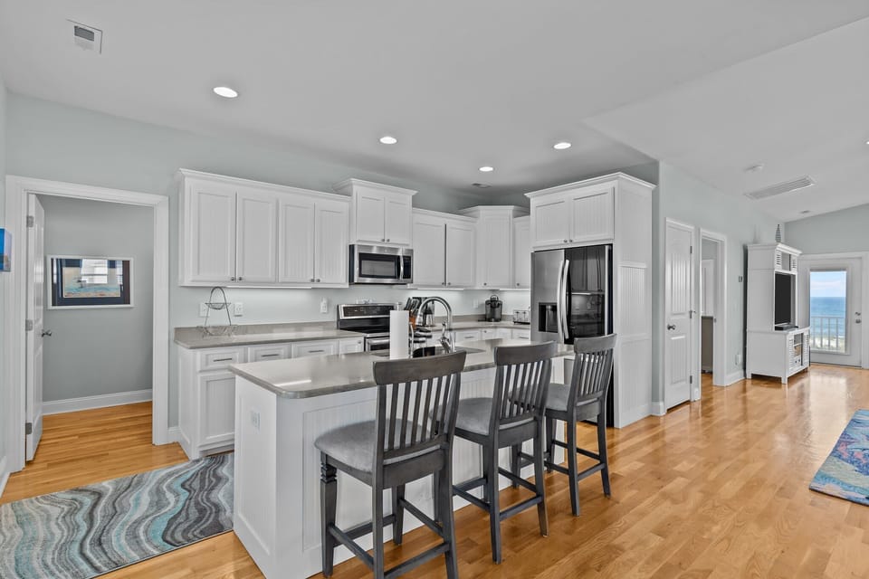 Sleek, Open-Concept Kitchen w/ Breakfast Bar Seating, Refrigerator, Oven, Stovetop, Microwave, and Much More
