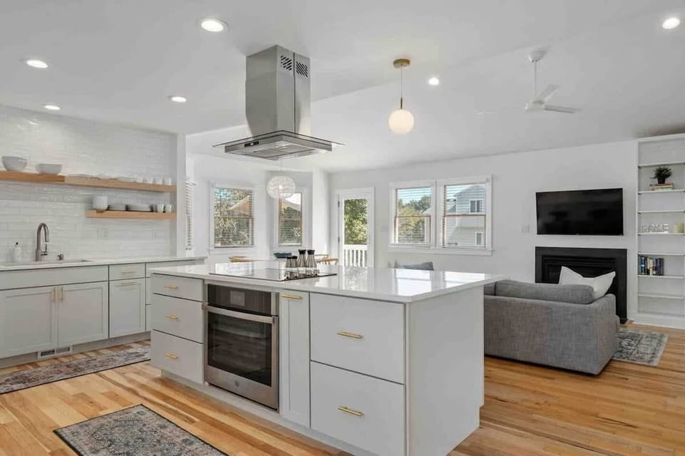 Featuring sleek quartz counters and a high-end suite of appliances - including a cooktop, oven, dishwasher,  refrigerator, and bar seating for 3—it’s designed for effortless entertaining. 