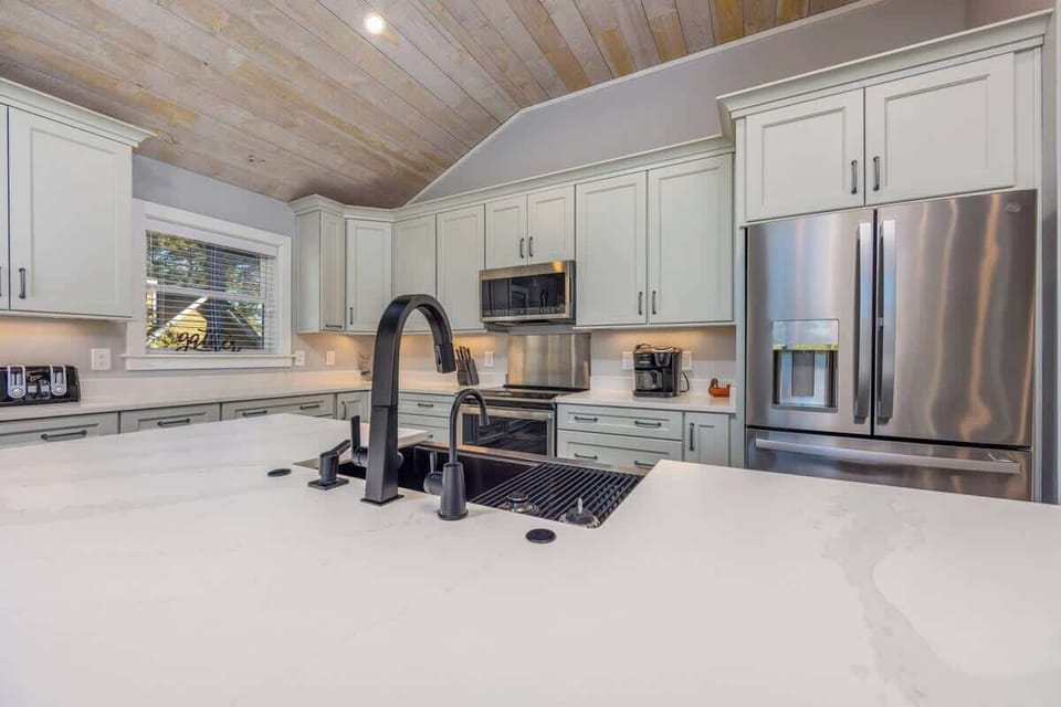 Updated Kitchen with Stainless Steel Appliances, Quartz Countertops, and Shaker Cabinets