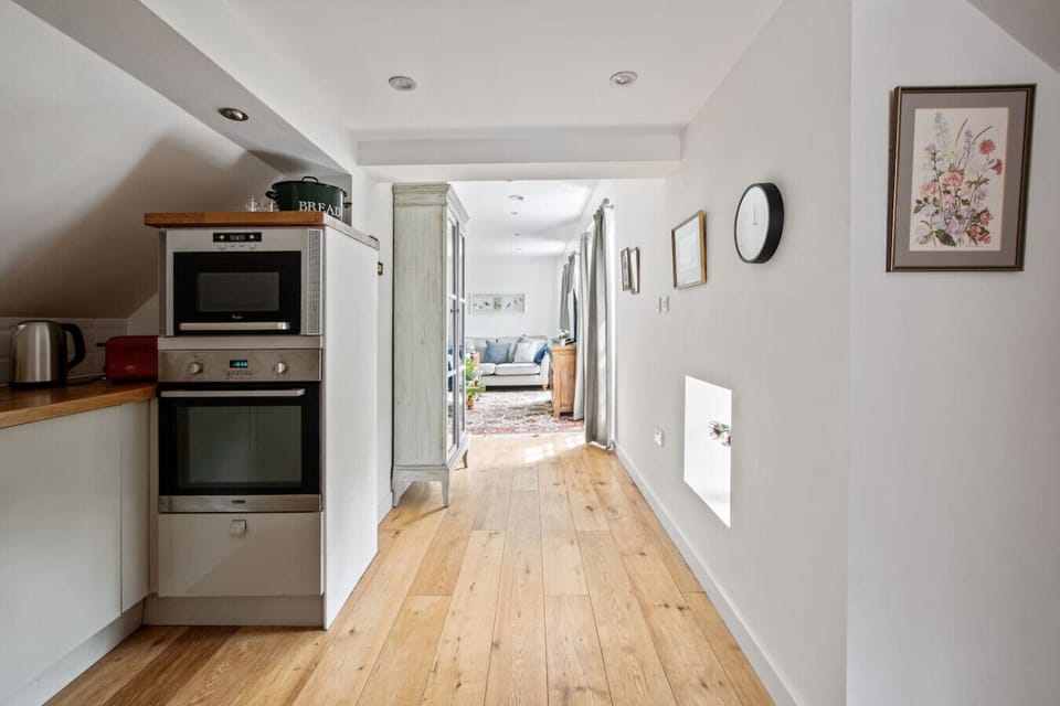 Open hallway connecting kitchen and living spaces