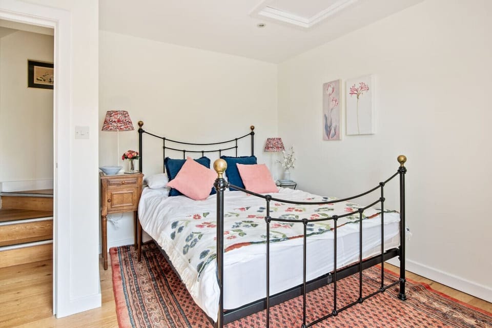 Double bedroom with floral touches and bright windows
