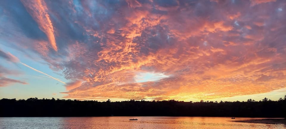 View of clear lake at sunset.