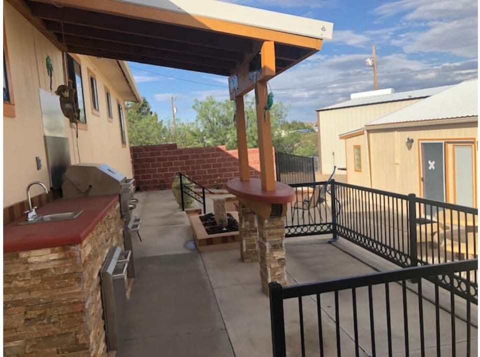 Patio with grill, fire pit & seating and water feature