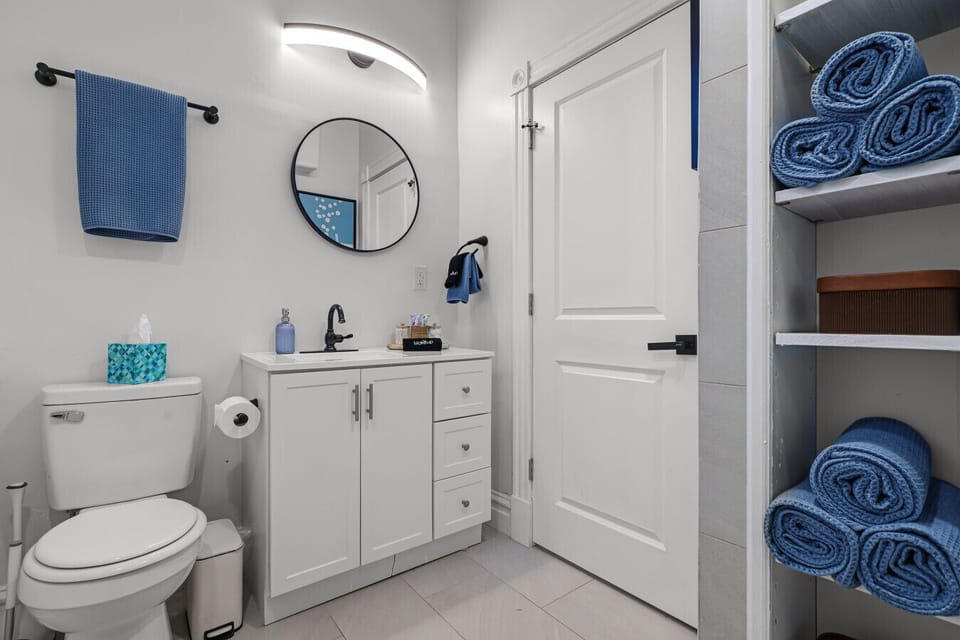 Located upstairs to the left, this bathroom features a stand-up shower, fresh towels, and essential toiletries including body wash, shampoo, conditioner, and hand soap—ensuring a comfortable and refreshing experience throughout your stay.