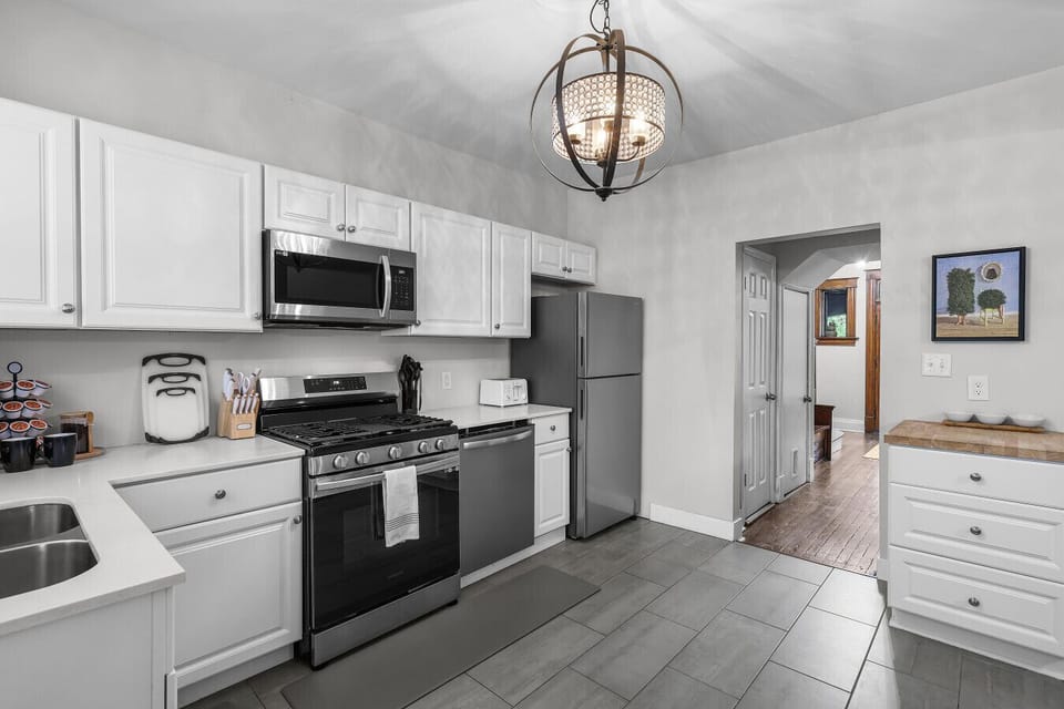 Our fully stocked kitchen boasts modern stainless steel appliances such as an oven/range, refridgerator/freezer,dishwasher and microwave, alongside all the cookware and utensils you need for a comfortable stay.