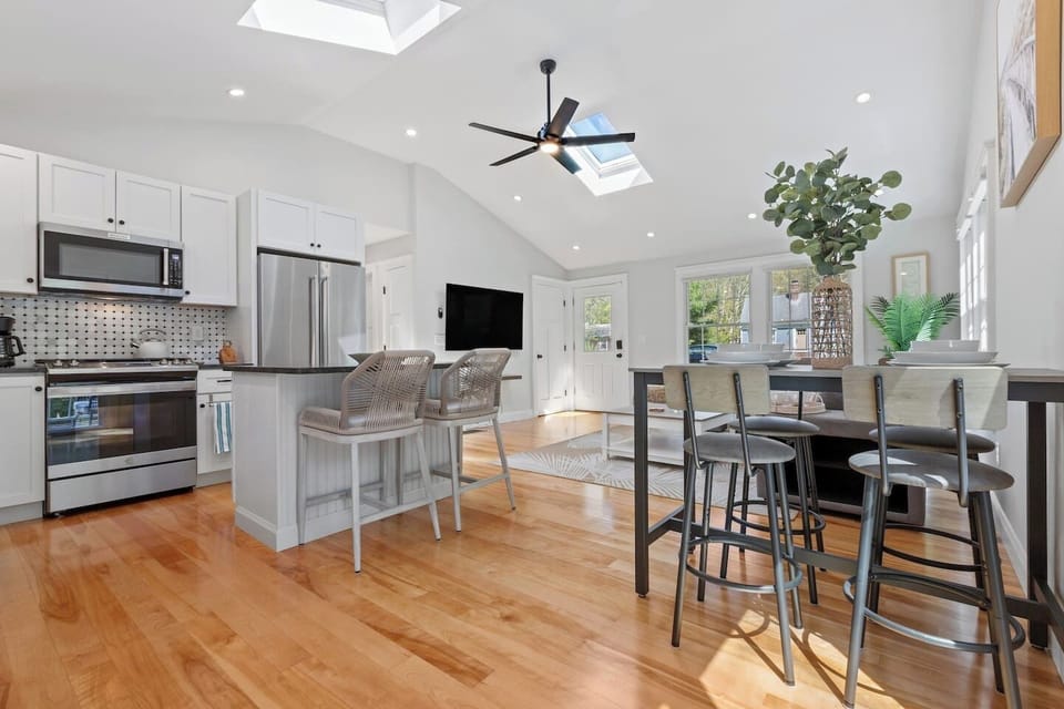 Open concept layout, where the kitchen island seamlessly connects to the welcoming living room.