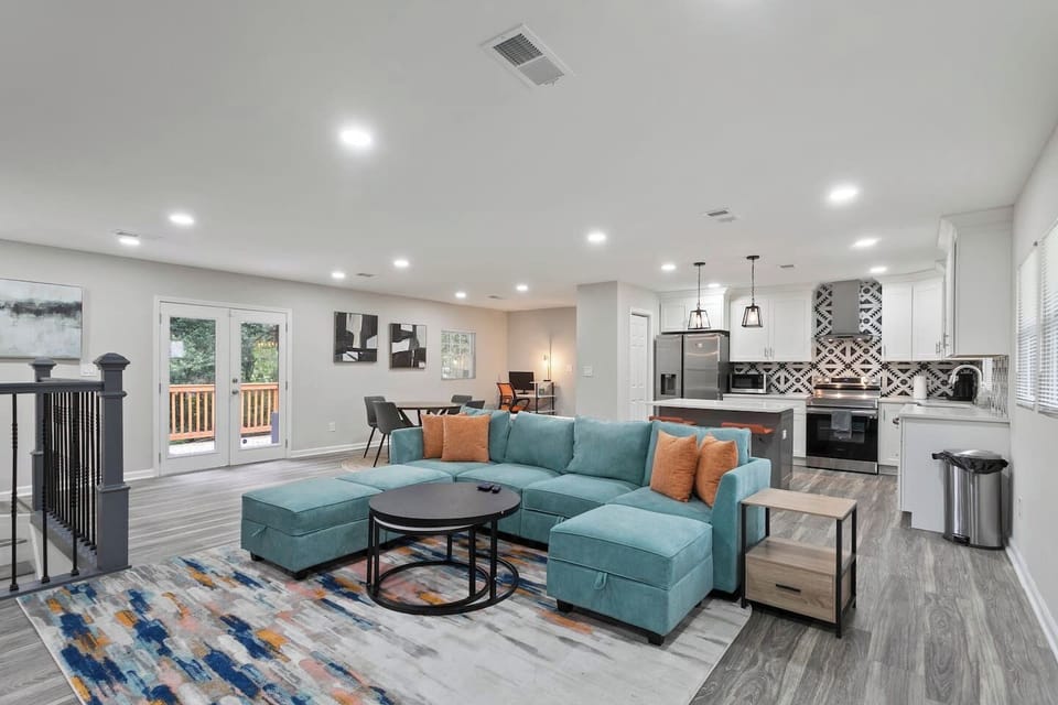 Our inviting living room with an L-shaped couch that provides cozy seating for bonding over movies and conversations.