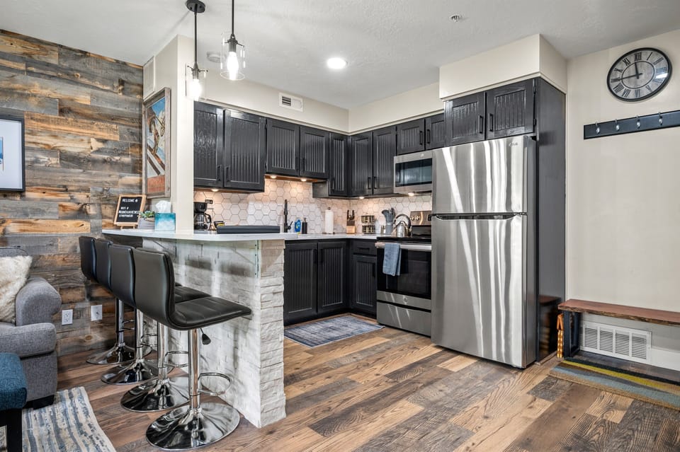 The kitchen bar has seating for four.