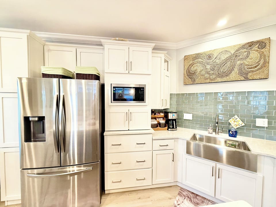 Wake up to fresh coffee at your own built-in coffee bar, complete with stainless steel appliances and plenty of space to gather.
