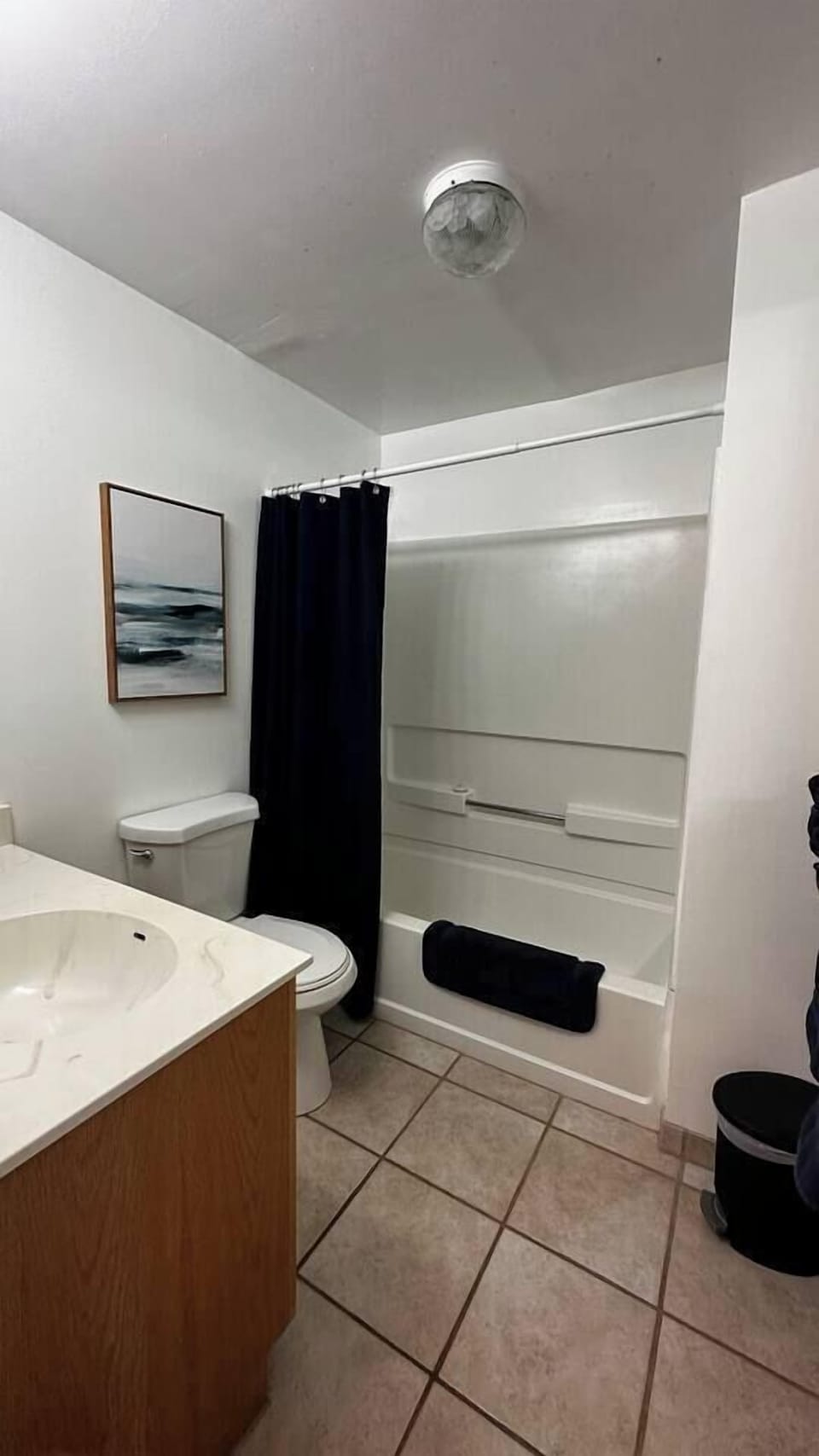The bathroom of the 2 bedroom houses with shower/tub and the essentials 
