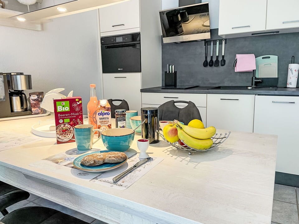 Furniture, Interior Design, Countertop, Kitchen, Flooring, Kitchen Appliance, Major Appliance, Floor, Cabinetry, Home Appliance