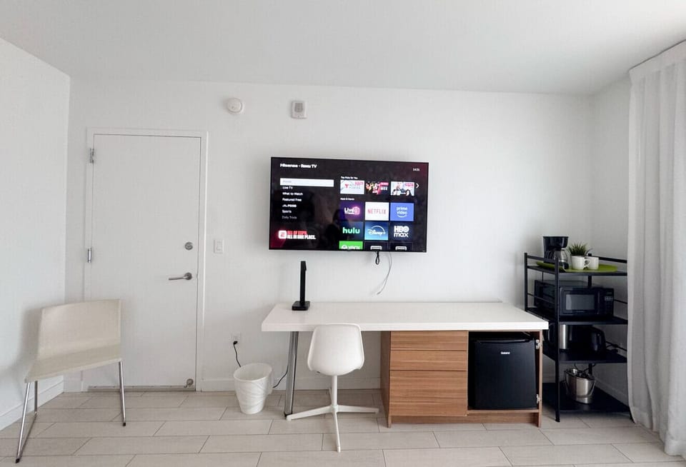 Functional workspace with Smart TV and modern decor.