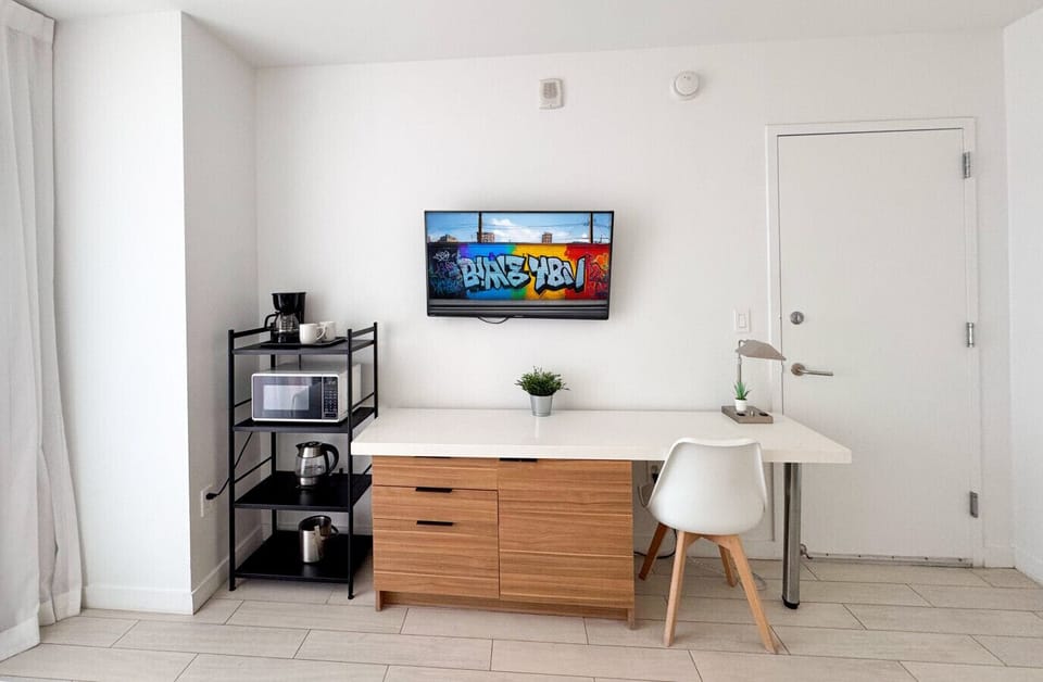 Functional workspace with Smart TV and modern decor.