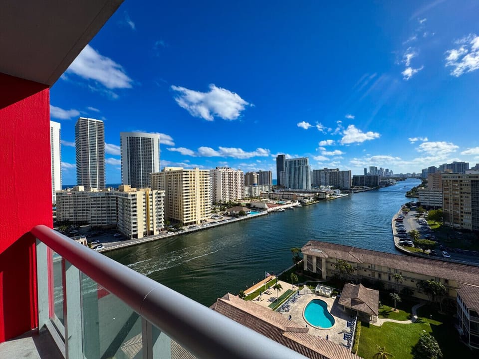Private balcony with outdoor seating and skyline views.