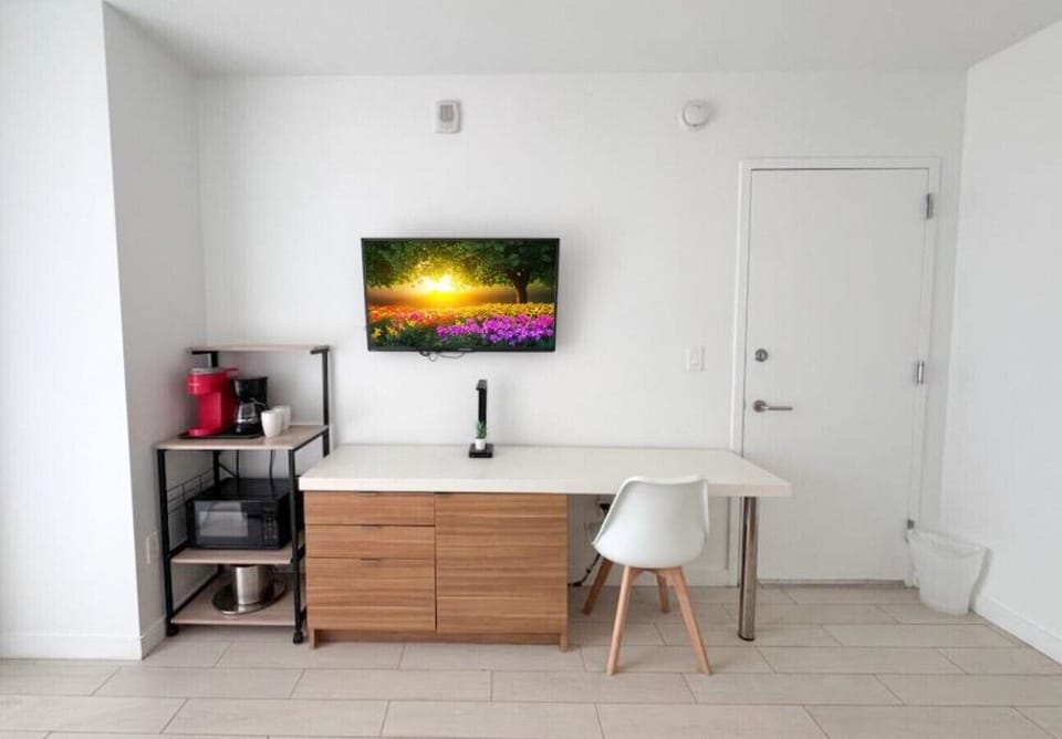 Functional workspace with Smart TV and modern decor.