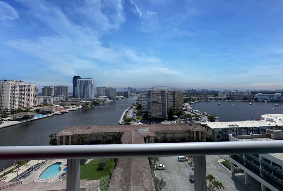 Private balcony with chairs and open city views.