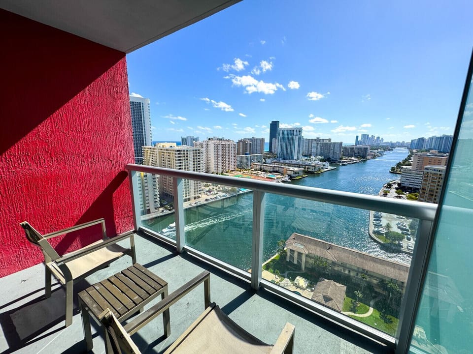 Private balcony with outdoor seating and skyline views.