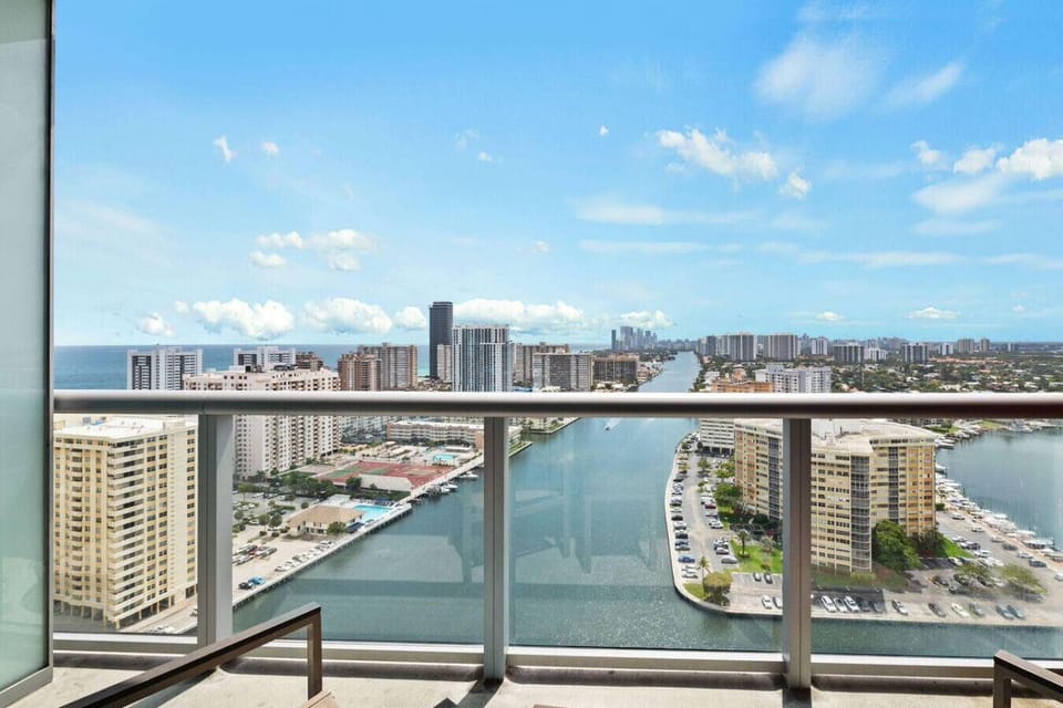 Private balcony with outdoor seating and skyline views.