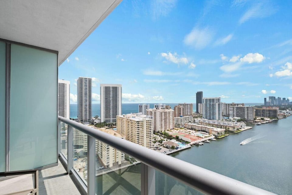 Private balcony with outdoor seating and skyline views.