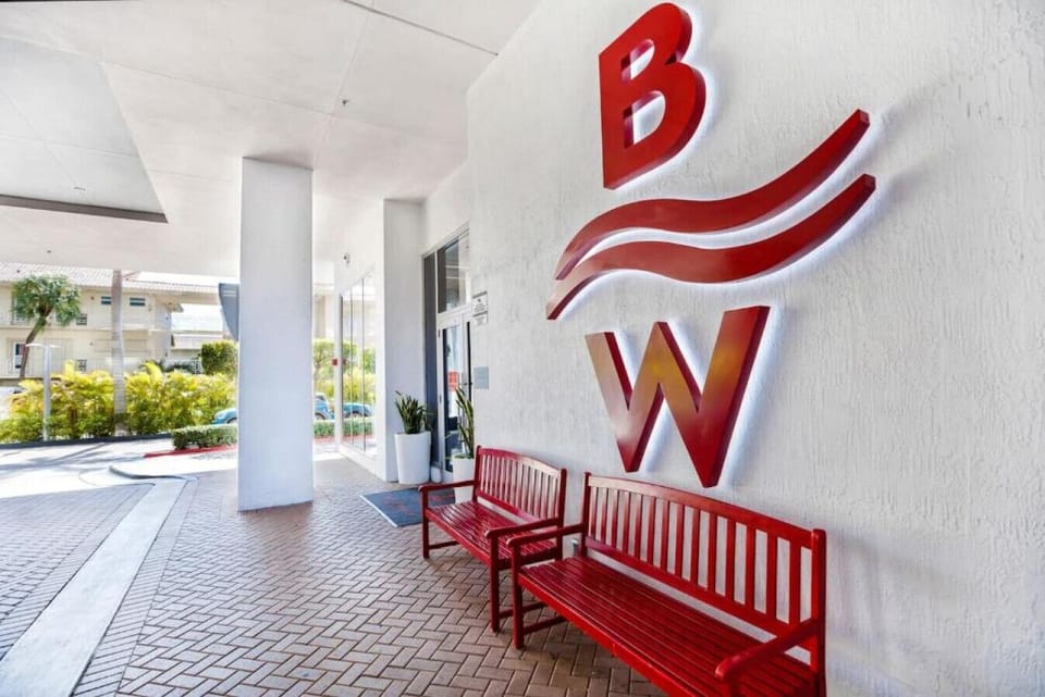 Main entrance to Beachwalk with the iconic red bench.