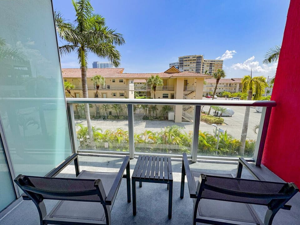 Stylish balcony with outdoor seating — ideal for sipping your morning coffee or unwinding at sunset.