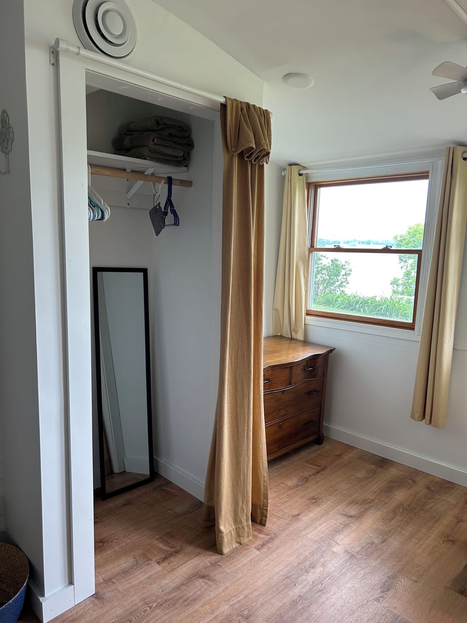 Bedroom closet and dresser.  