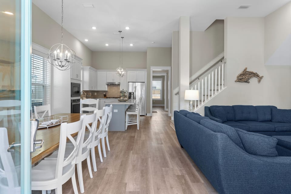Open concept layout with coastal decor.