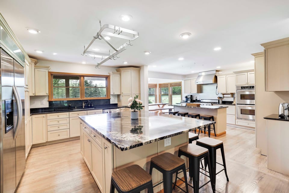 Open concept kitchen is a chef's dream - 2 islands, Viking range, double oven