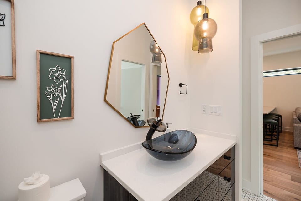 Beautiful spa-inspired bathrooms with plush towels and upscale finishes provide comfort and relaxation after a day exploring Wilmington.