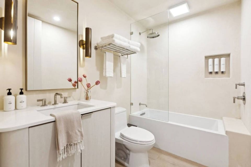 En-suite bathroom with rain shower and high-end toiletries
