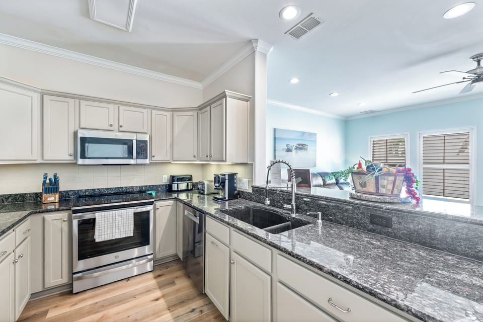 Your fully equipped gourmet kitchen awaits with granite countertops, stainless appliances, and everything you need to create memorable meals during your stay.