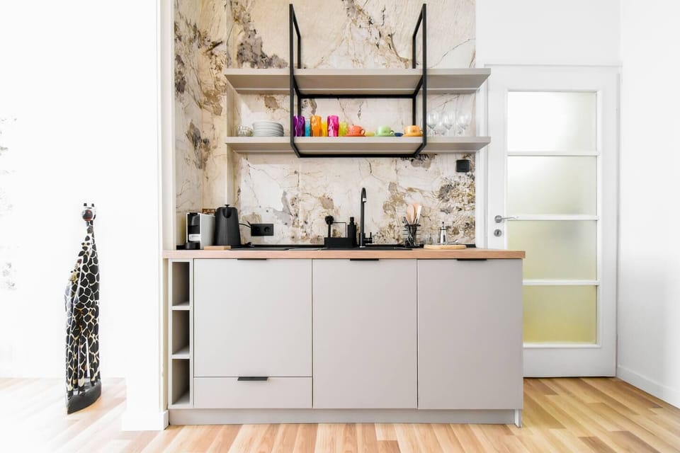 A sleek and functional kitchen with all the basics, ideal for cooking a quick meal or enjoying a quiet breakfast.