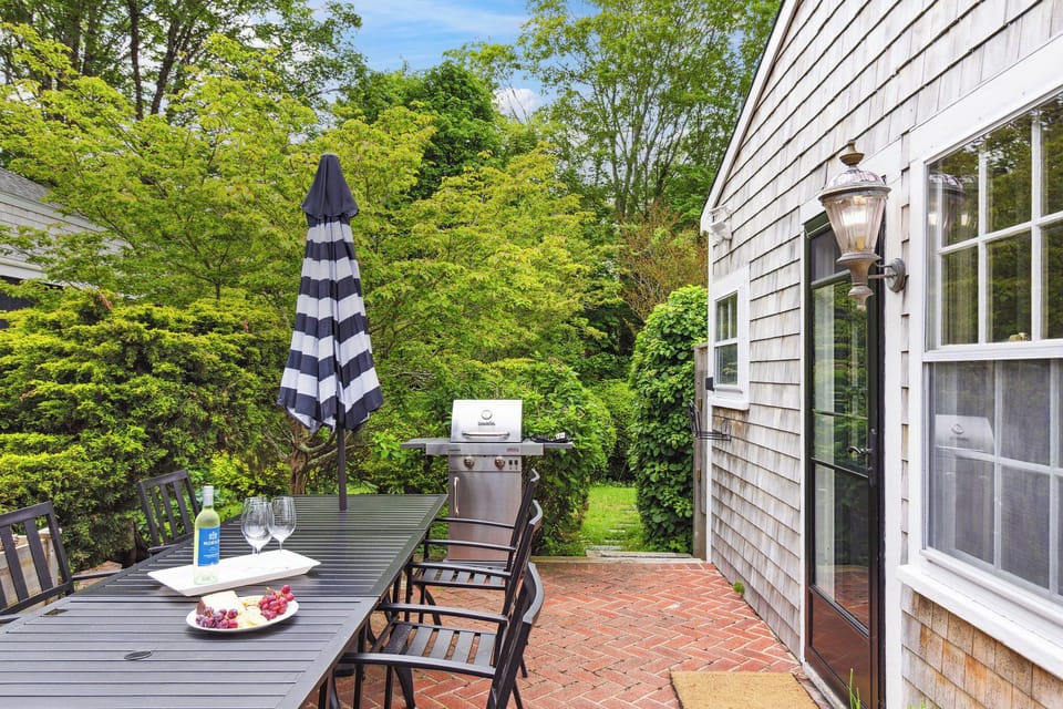 Main House: Patio - dining table w/ seating for 10 guests, umbrella & grill. 