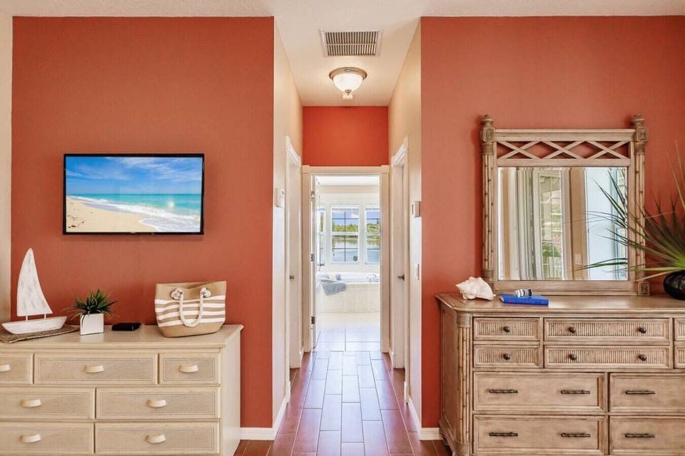 Primary Bedroom, Dressers and View to En Suite Full Bathroom
