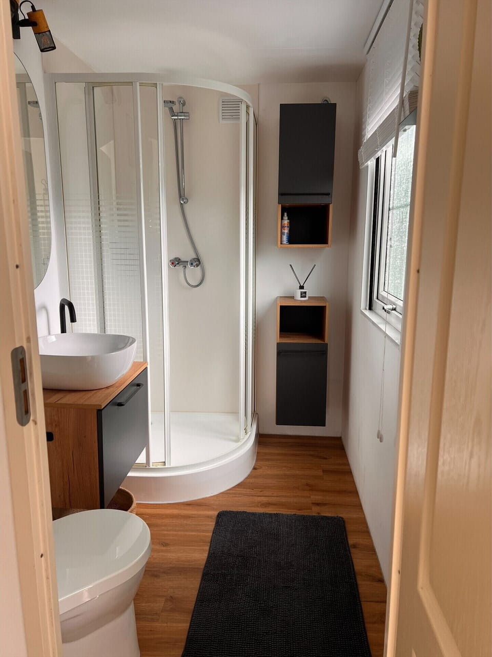 Bathroom with shower, sink and toilet
