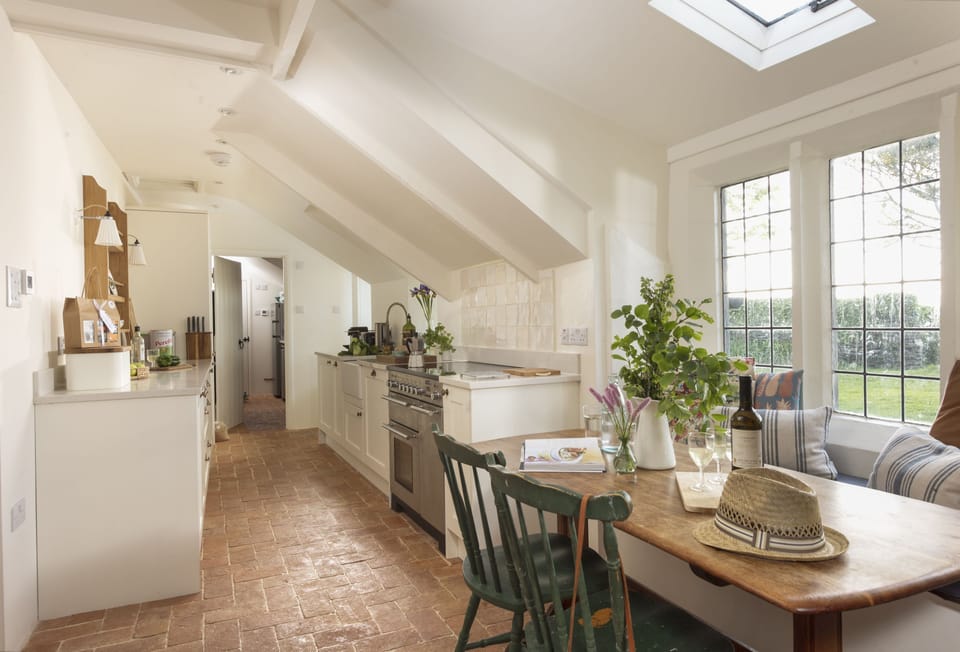 Besloe, Tintagel. Ground Floor: At the heart of the home is a well-equipped kitchen where modern convenience meets rustic charm