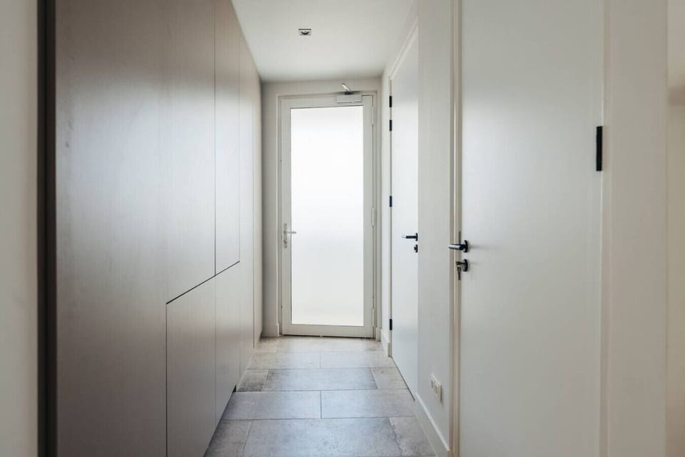 Welcome to ONE Mambo 32—step through this bright, modern entrance and into your private island escape.