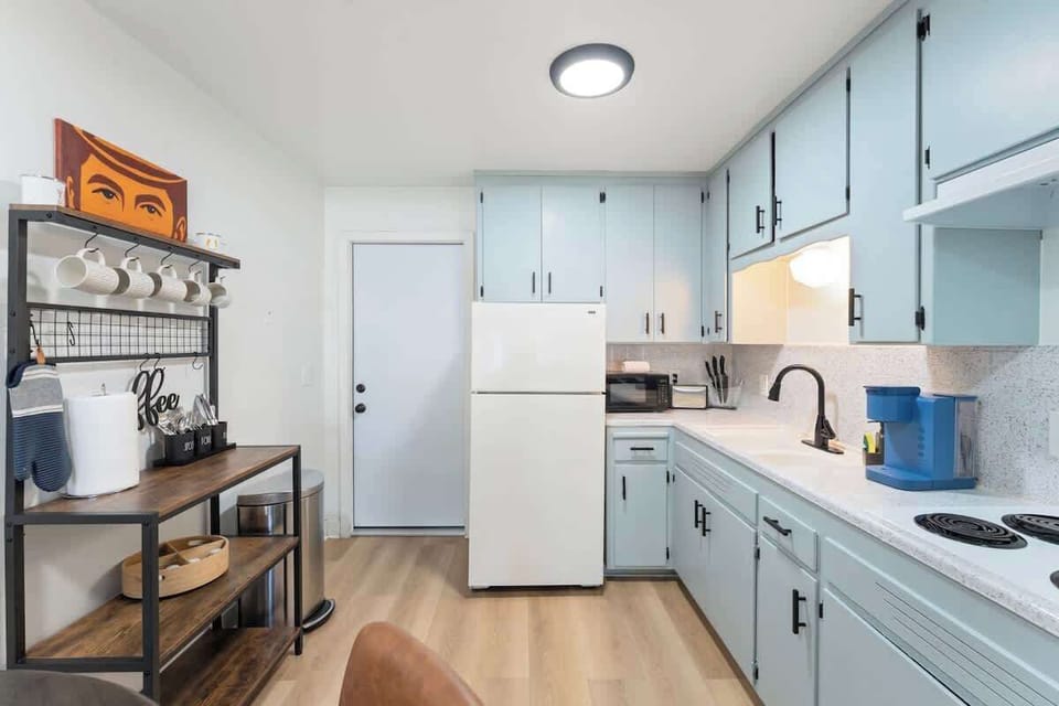 Fully stocked kitchen with Keurig machine.