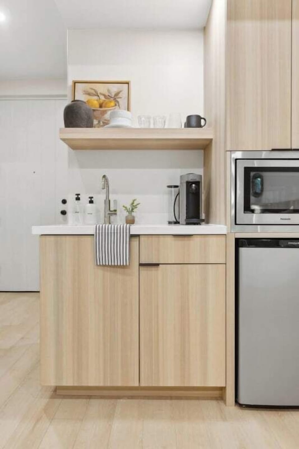 Kitchenette: Nespresso, mini-fridge, air-fryer microwave, plates, no stove
