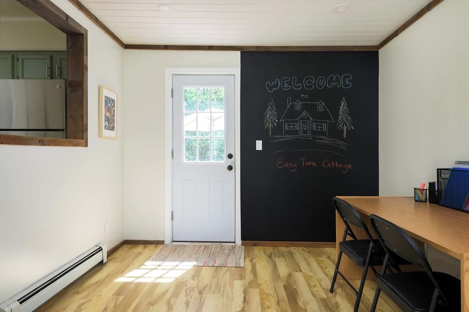 This oversized chalkboard wall sets the tone for creativity, whether you're sketching a masterpiece or leaving a note for the next guest.