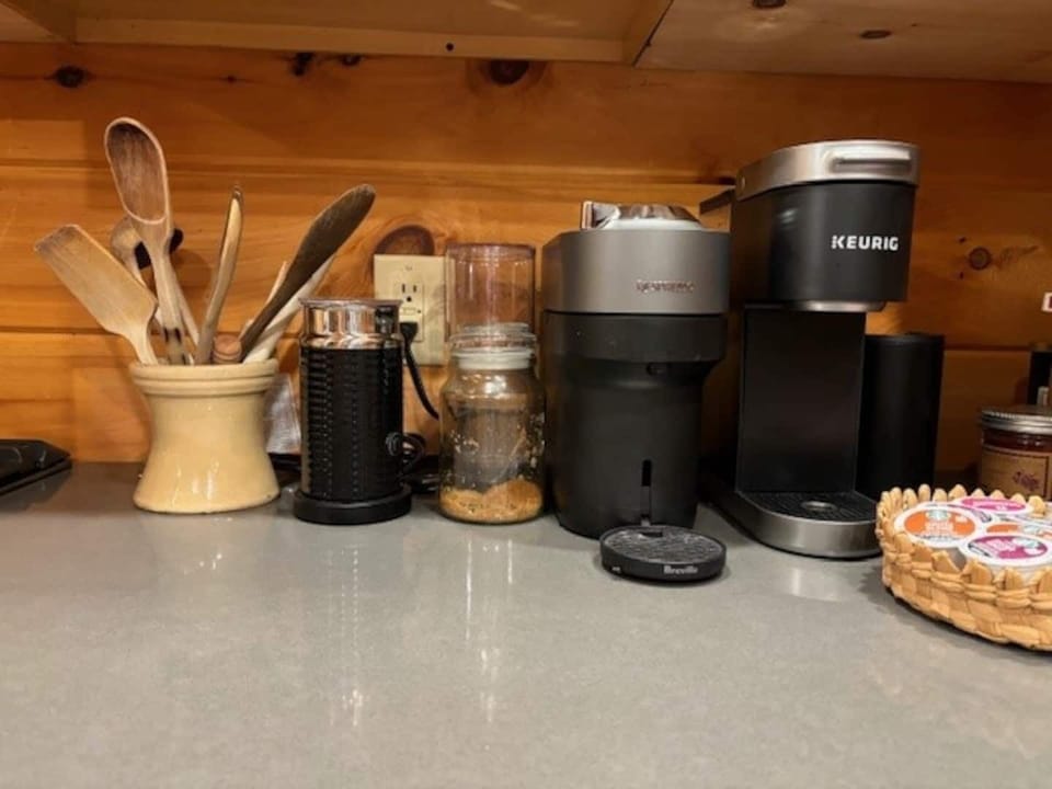 Espresso and coffee station with pods and sugar. Bring your favorite milk to pass by the milk frother for an over the top coffee/tea experience. 