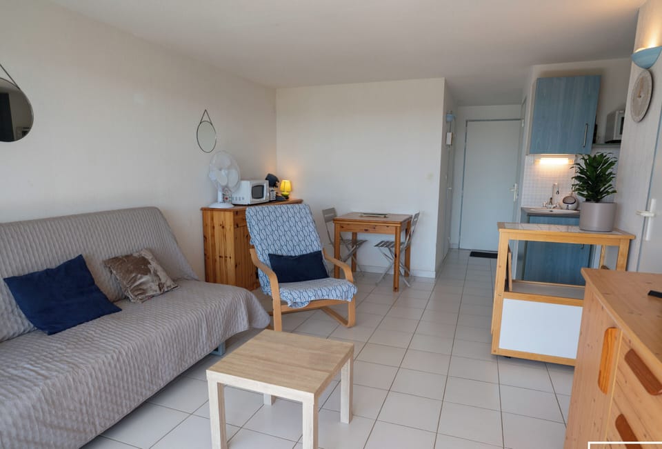 Living room opening onto kitchen and terrace