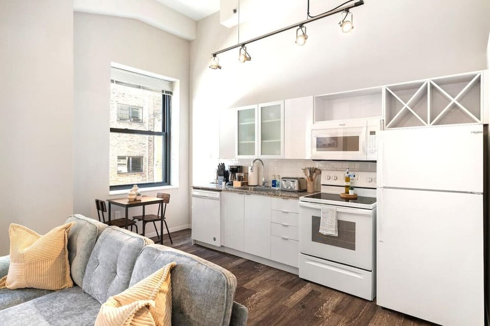 The kitchen’s open layout allows you to move freely as you prepare meals, with everything you need at your fingertips.