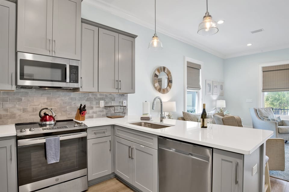Kitchen fully stocked with everything from gourmet cooking essentials to endless coffee options