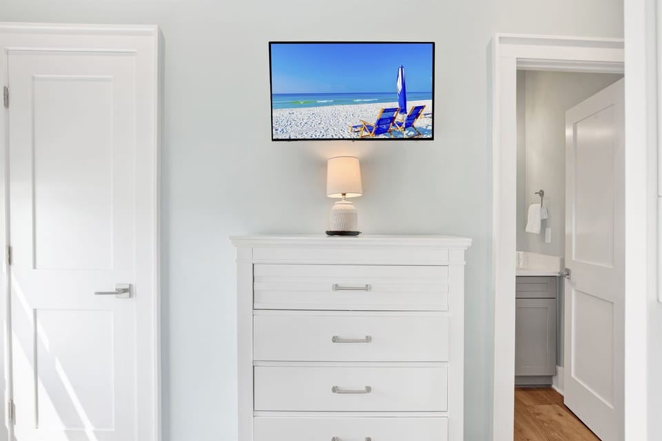 Our spacious bunk bedroom features two twin over full bunk beds and a TV with a gaming console, creating the ultimate sleep and play haven for all